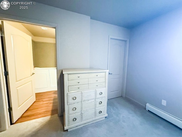 2794 Elizabeth St, Canon City, CO 81212 - unfurnished bedroom featuring a baseboard heating unit and light carpet