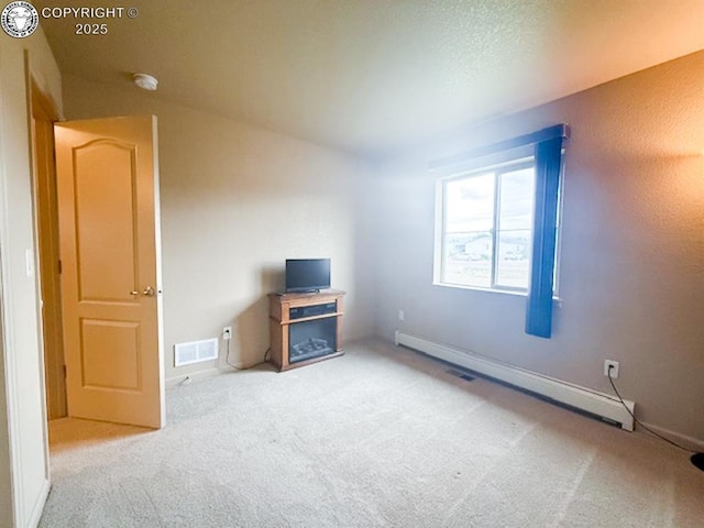 2794 Elizabeth St, Canon City, CO 81212 - unfurnished living room with baseboard heating and carpet