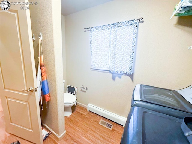 2794 Elizabeth St, Canon City, CO 81212 - bathroom featuring wood finished floors and a baseboard radiator