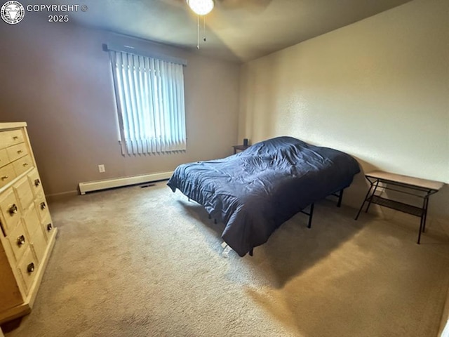 2794 Elizabeth St, Canon City, CO 81212 - carpeted bedroom with a baseboard radiator and a ceiling fan