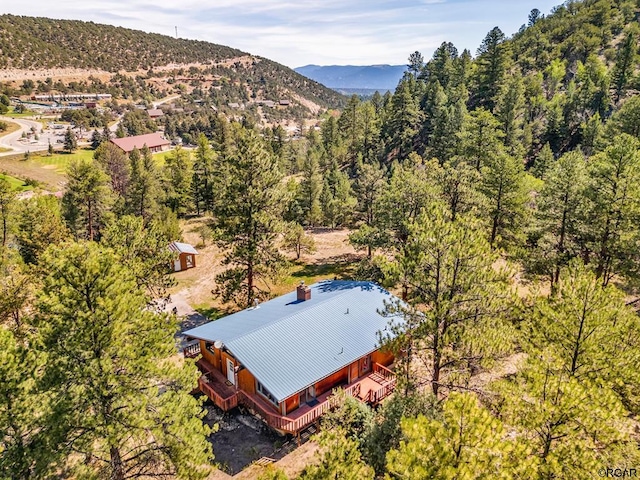 birds eye view of property with a mountain view