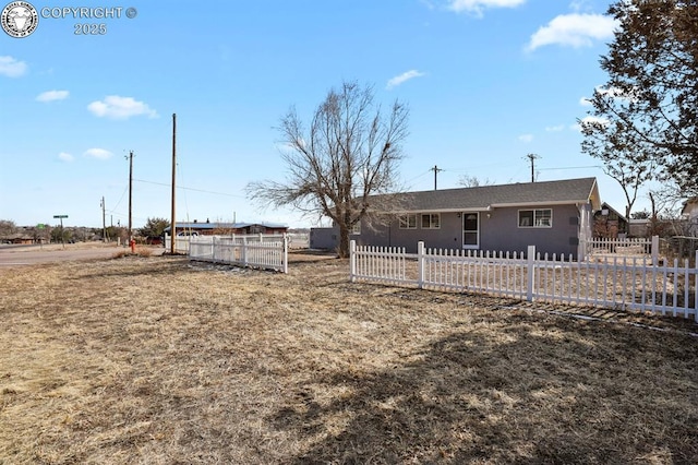 exterior space featuring a fenced front yard