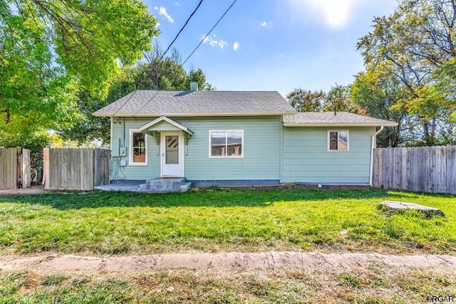 bungalow-style home with a front lawn