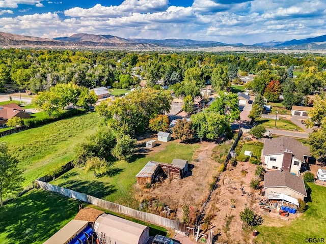 birds eye view of property featuring a mountain view