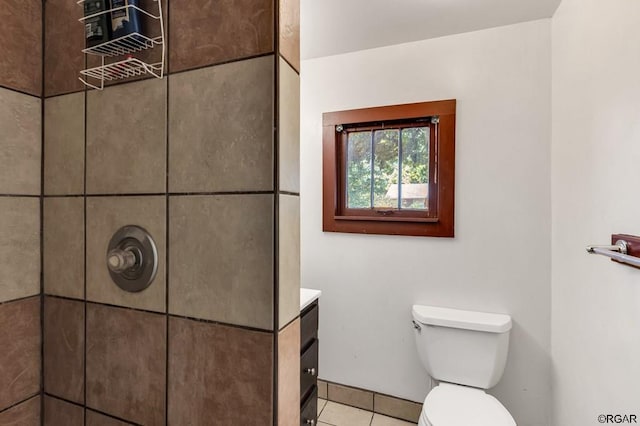 bathroom with vanity, tile patterned flooring, and toilet