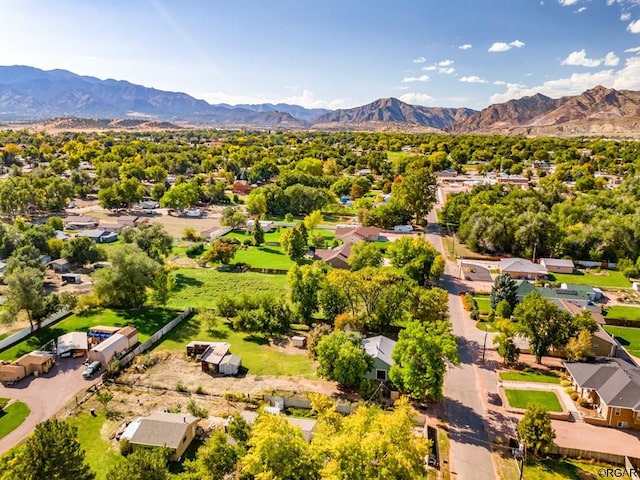 birds eye view of property with a mountain view