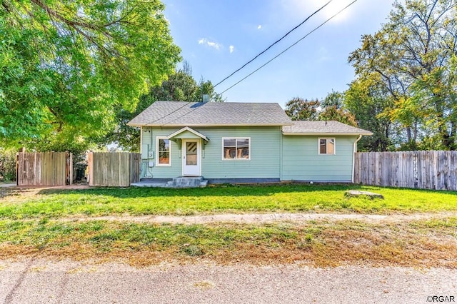 bungalow-style house featuring a front yard