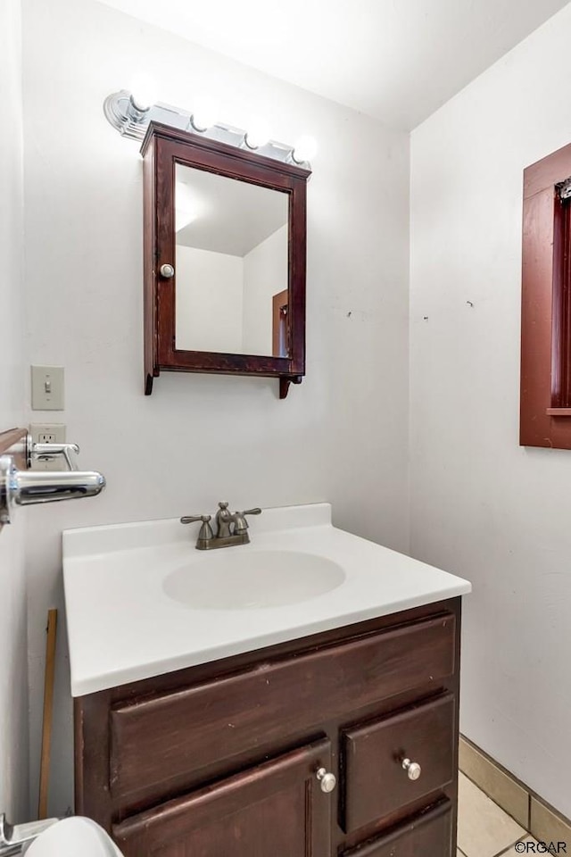 bathroom with vanity and tile patterned floors