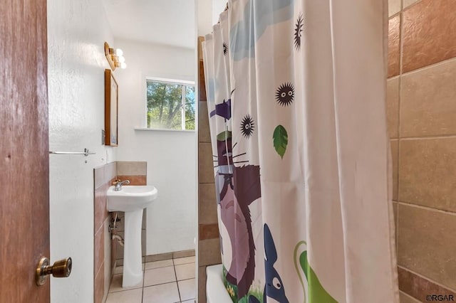 bathroom with tile patterned flooring and sink