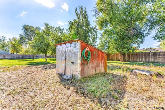 view of outdoor structure with a lawn