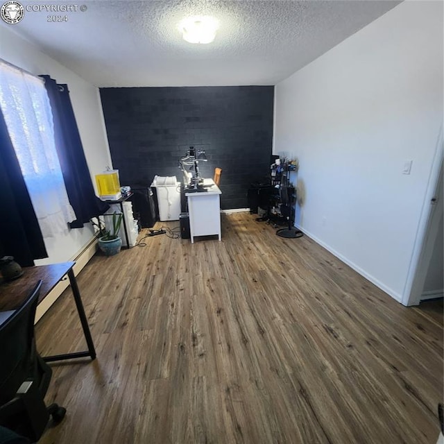 interior space featuring dark hardwood / wood-style floors and a textured ceiling