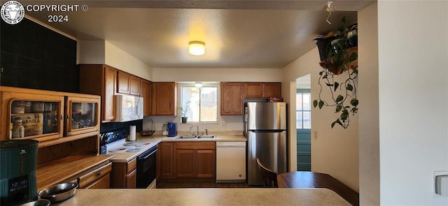 kitchen featuring sink and white appliances