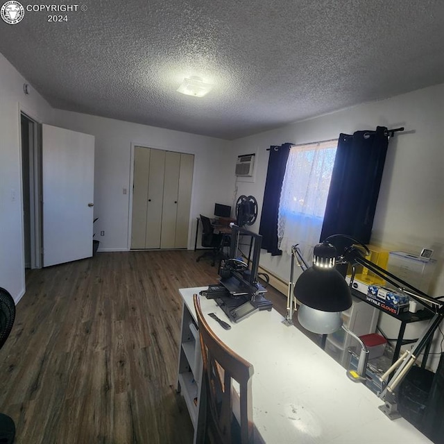 office featuring dark hardwood / wood-style flooring and a textured ceiling