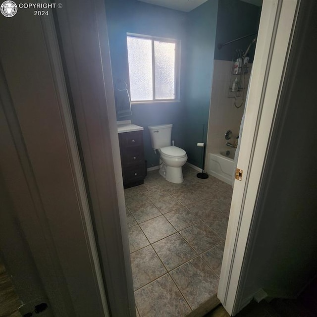 full bathroom with shower / bathtub combination, tile patterned floors, toilet, and vanity