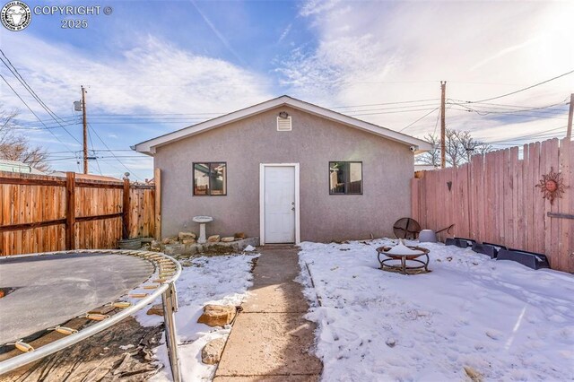 view of snow covered house