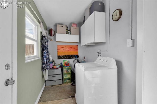 laundry area with washer / clothes dryer and cabinets