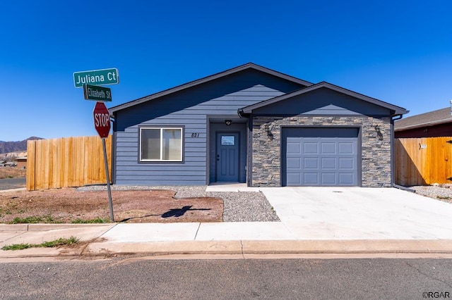 ranch-style home featuring a garage