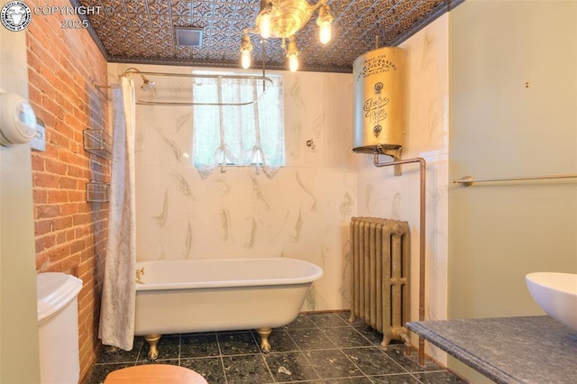 417 Greenwood Ave, Canon City, CO 81212 - bathroom with radiator heating unit, an ornate ceiling, and water heater