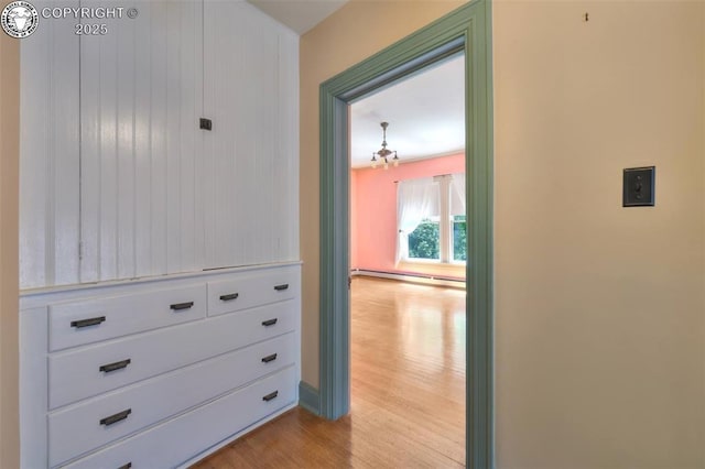417 Greenwood Ave, Canon City, CO 81212 - hall featuring light wood-type flooring, a chandelier, and baseboard heating