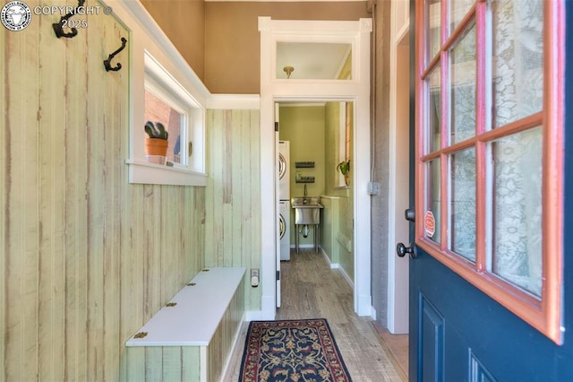 417 Greenwood Ave, Canon City, CO 81212 - mudroom with stacked washer and clothes dryer and wood finished floors