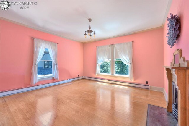 417 Greenwood Ave, Canon City, CO 81212 - unfurnished living room with healthy amount of natural light, a chandelier, and wood finished floors