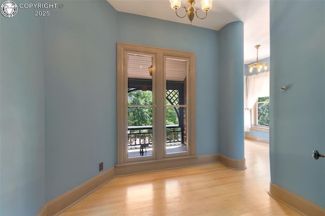 417 Greenwood Ave, Canon City, CO 81212 - unfurnished room featuring a chandelier and wood finished floors
