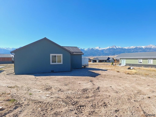 rear view of house with a mountain view