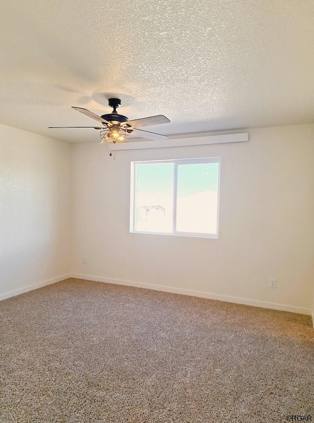 unfurnished room featuring ceiling fan, carpet floors, and a textured ceiling