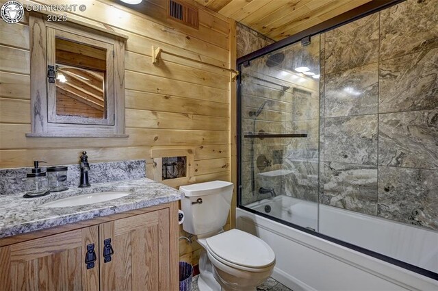 540 County Road 356, Westcliffe, CO 81252 - full bathroom featuring vanity, toilet, wood ceiling, combined bath / shower with glass door, and wooden walls