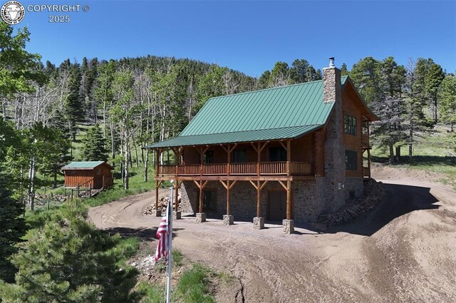 540 County Road 356, Westcliffe, CO 81252 - surrounding community featuring driveway, a view of trees, and a wooden deck