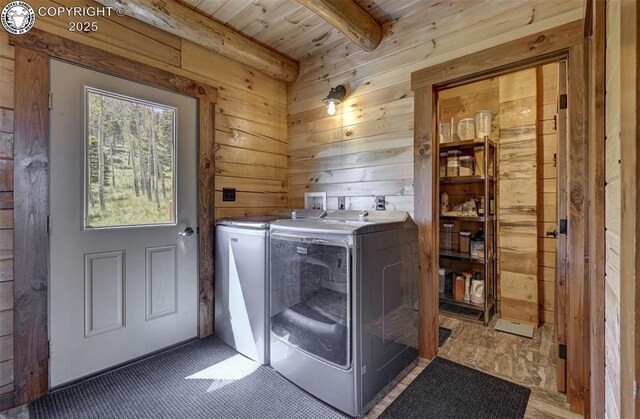 540 County Road 356, Westcliffe, CO 81252 - laundry area with washer and clothes dryer, wooden walls, and wood ceiling