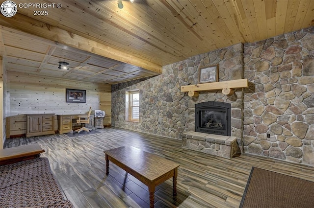 540 County Road 356, Westcliffe, CO 81252 - living area featuring wooden ceiling, a fireplace, a desk, wood finished floors, and wood walls