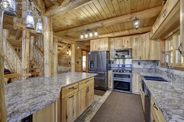 540 County Road 356, Westcliffe, CO 81252 - kitchen with appliances with stainless steel finishes, a sink, wooden ceiling with exposed beams, light stone counters, and decorative backsplash
