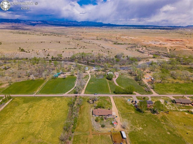 bird's eye view featuring a mountain view and a rural view