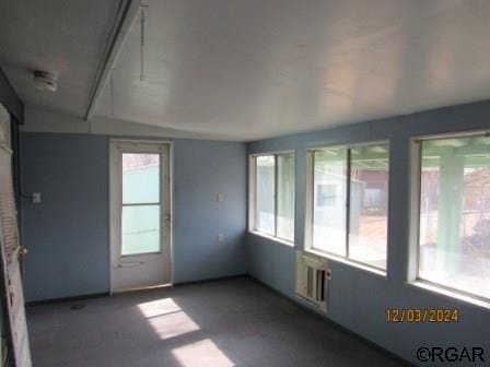 unfurnished sunroom with a wealth of natural light