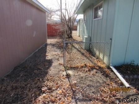 view of home's exterior with fence