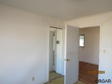 unfurnished bedroom featuring a closet