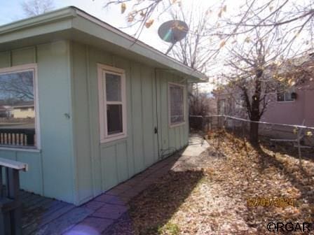 view of home's exterior featuring fence