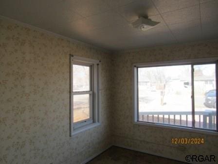 empty room with wallpapered walls