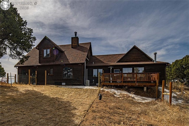 252 Apache Trl, Cotopaxi, CO 81223 - back of property featuring a shingled roof, a deck, and a chimney