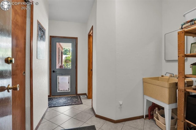 1124 Grand Ave, Canon City, CO 81212 - entryway featuring light tile patterned flooring and baseboards