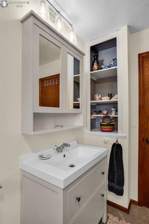 1124 Grand Ave, Canon City, CO 81212 - bathroom featuring vanity and a textured ceiling