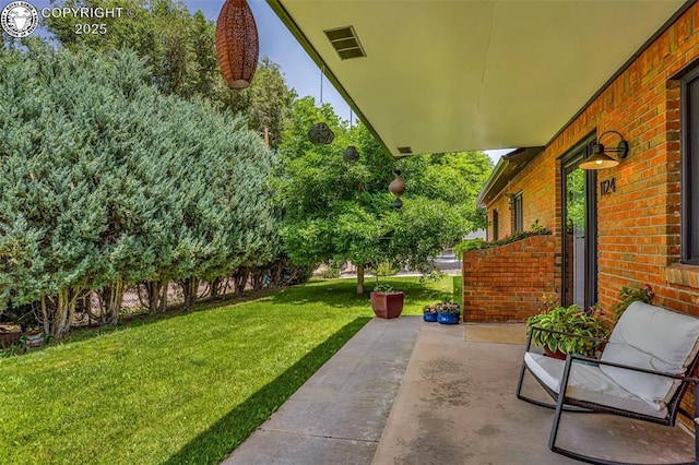1124 Grand Ave, Canon City, CO 81212 - view of grassy yard featuring a patio area