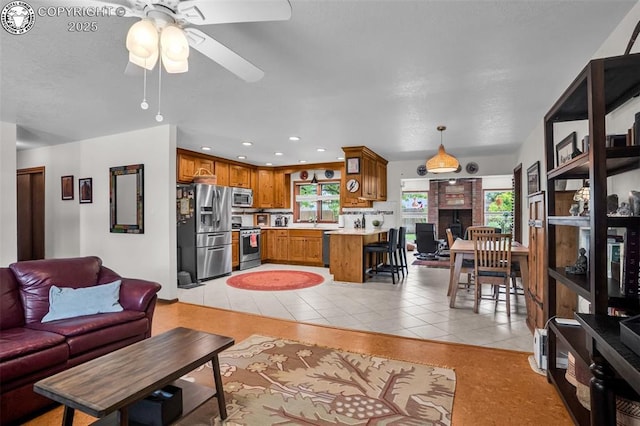 1124 Grand Ave, Canon City, CO 81212 - living area featuring light tile patterned flooring, ceiling fan, and recessed lighting