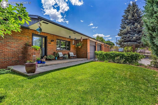 1124 Grand Ave, Canon City, CO 81212 - rear view of house with brick siding and an attached garage