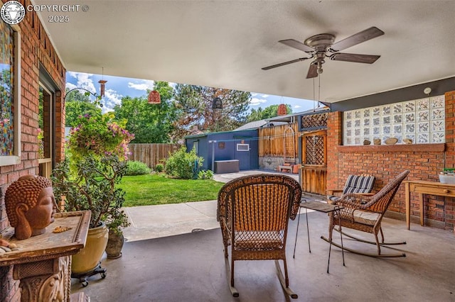 1124 Grand Ave, Canon City, CO 81212 - fenced backyard with a patio area, ceiling fan, and a shed