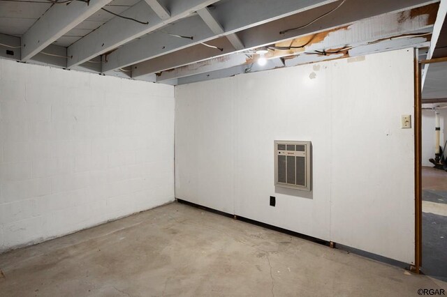 basement featuring heating unit