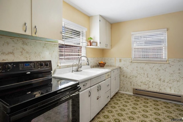 kitchen with black / electric stove, sink, white cabinets, and baseboard heating