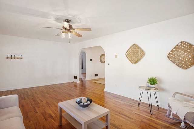 living room featuring hardwood / wood-style flooring and ceiling fan