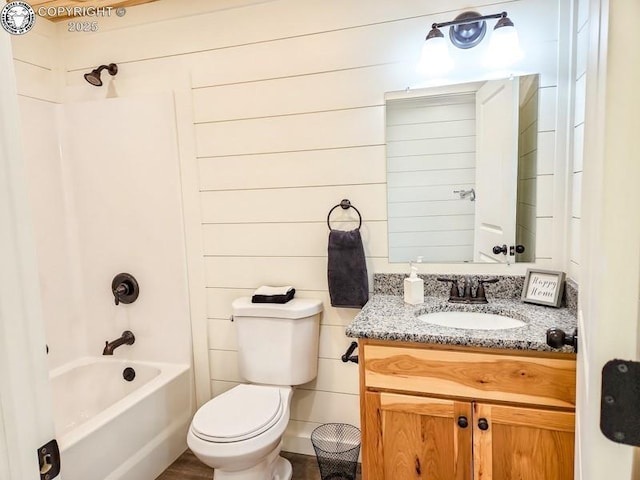full bathroom featuring toilet, shower / bathing tub combination, and vanity